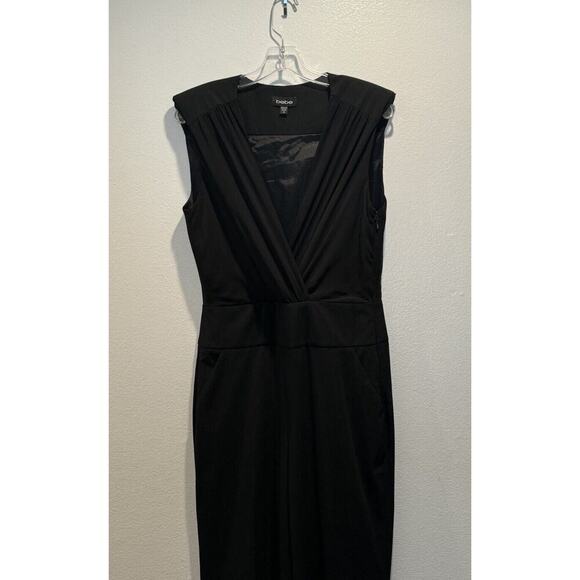 BEBE Women’s Size 10 Sleeveless Black Jumpsuit Pockets Deep V-Neck Classic Glam - Picture 3 of 8